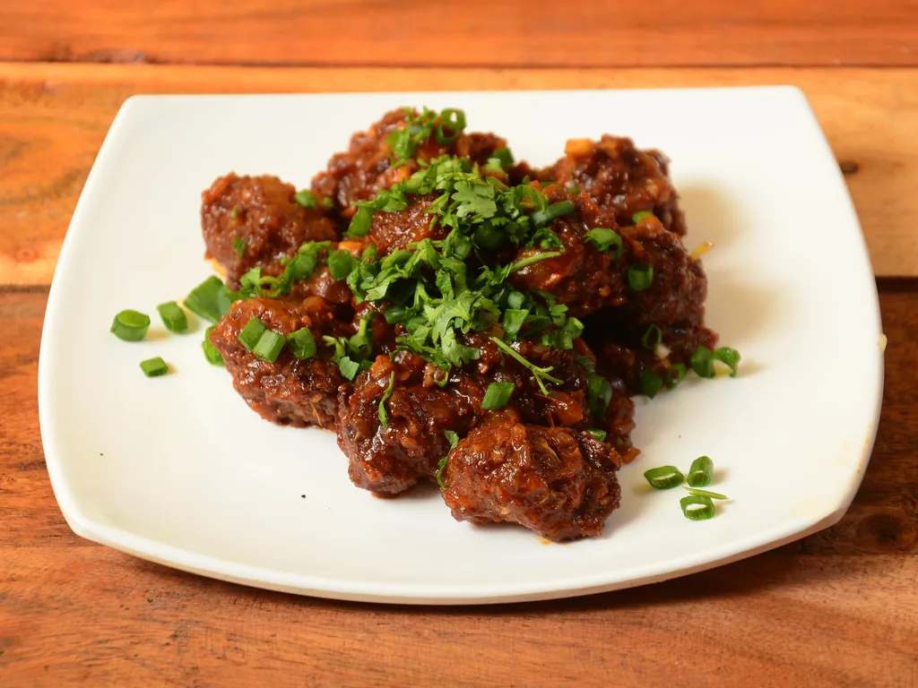 Vegetable Manchurian at Sweet-Chili Authentic Indian Restaurant Edmonton - crispy vegetable balls tossed in a savoury Indo-Chinese sauce